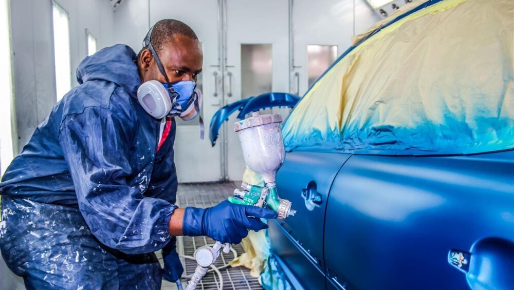 a man painting a car