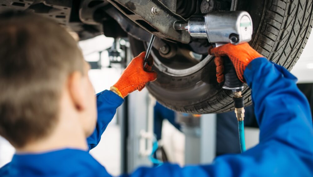 a man working on a car